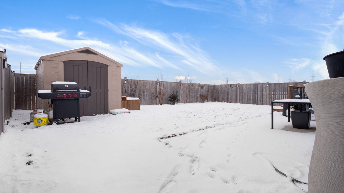 Storage shed tucked in back corner thumbnail